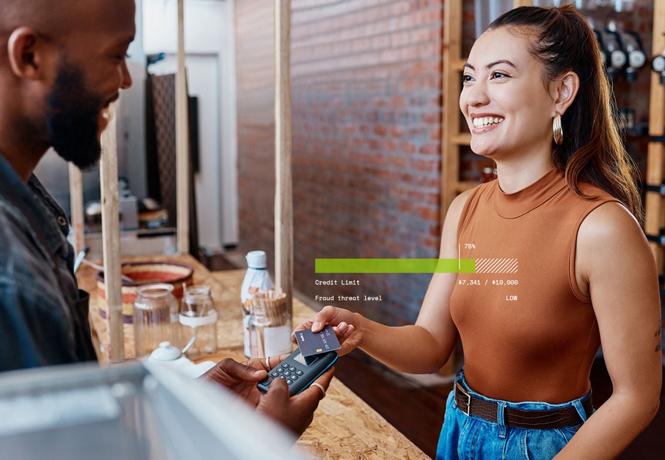 Woman paying at a store with credit card