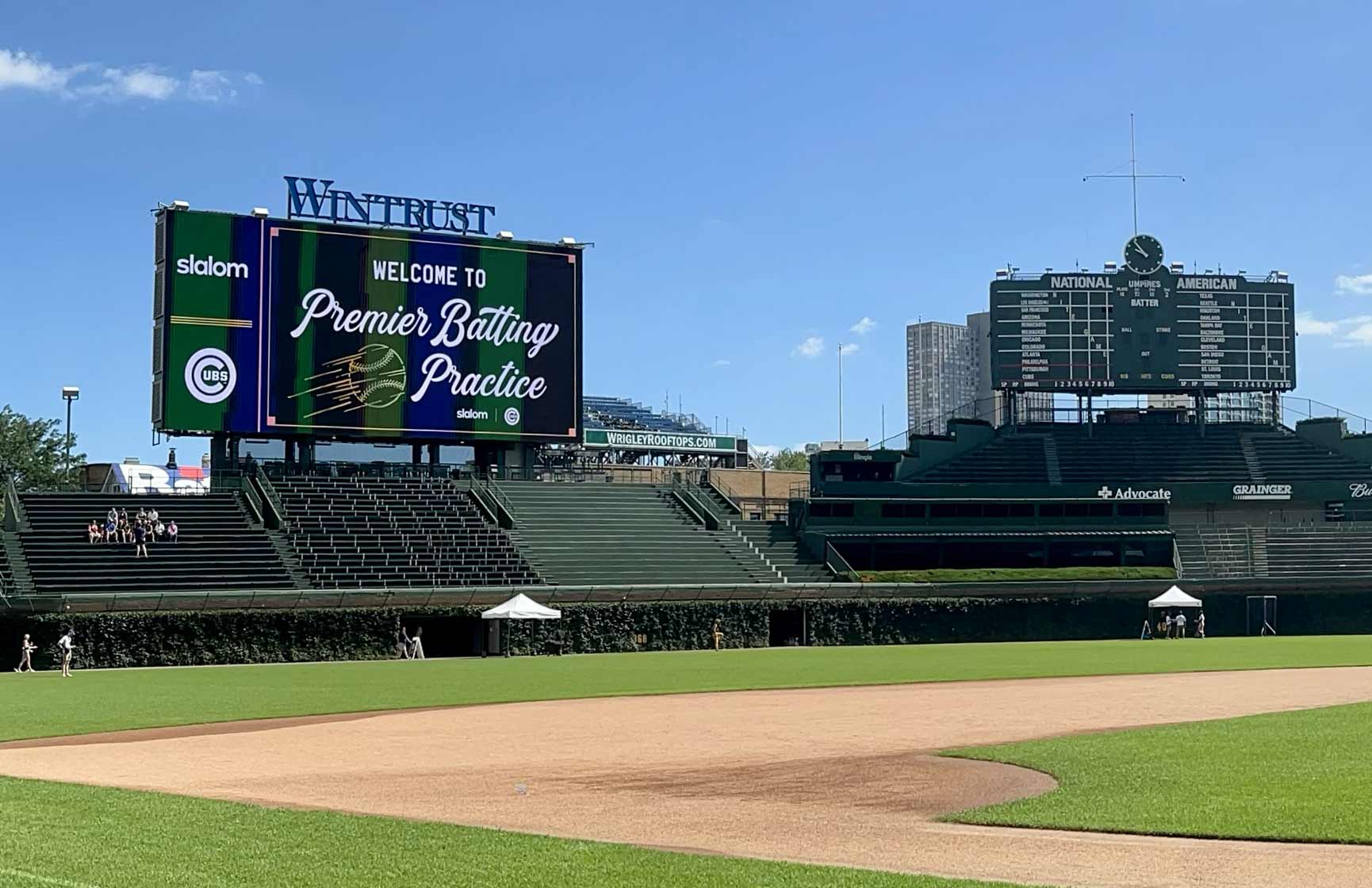 A field view of the baseball scoreboard with Wintrust on top. 