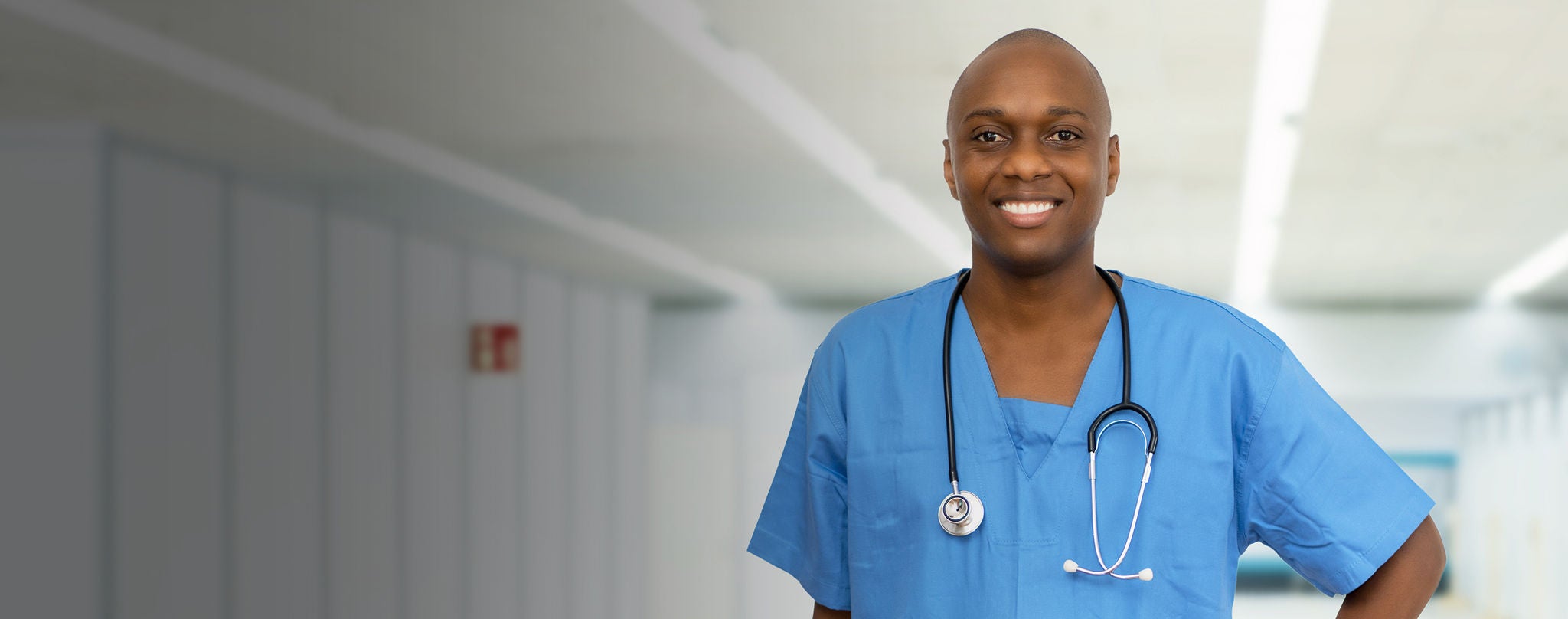 Mature adult african american male nurse at vaccination station for vacinating patients