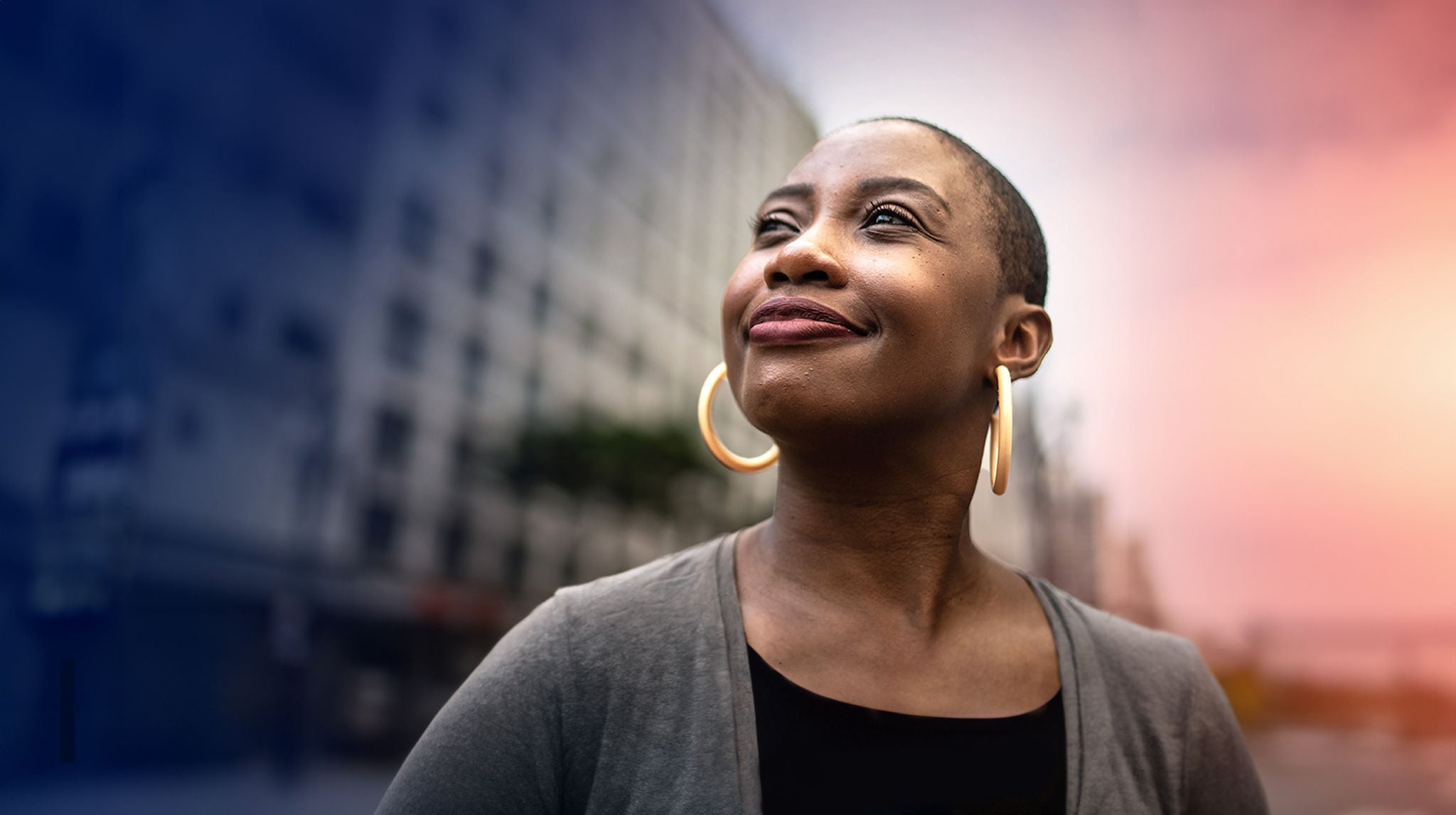 A woman looks to the sky.