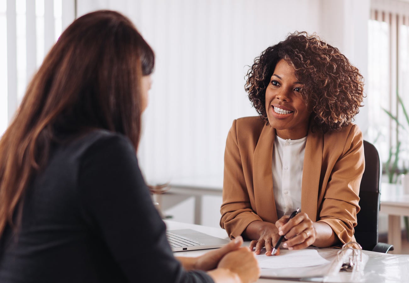 Two people meet to discuss banking matters.