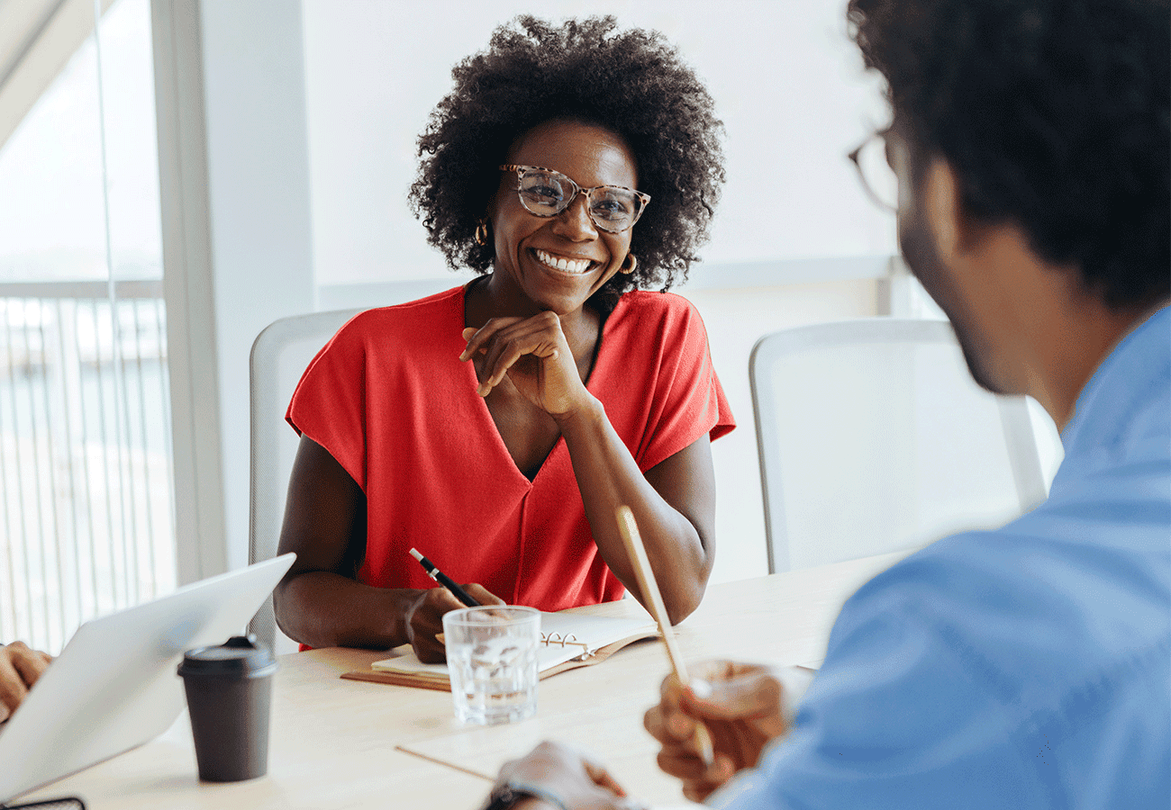 aws ai campaign woman in red shirt