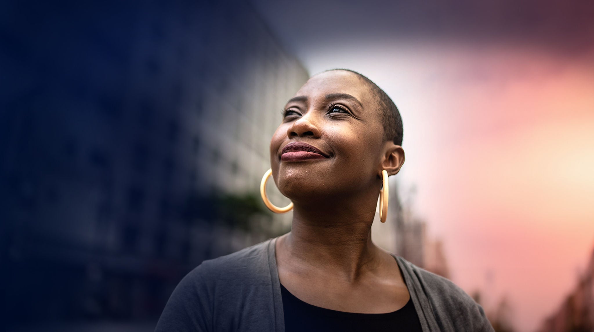 A woman looks to the sky.