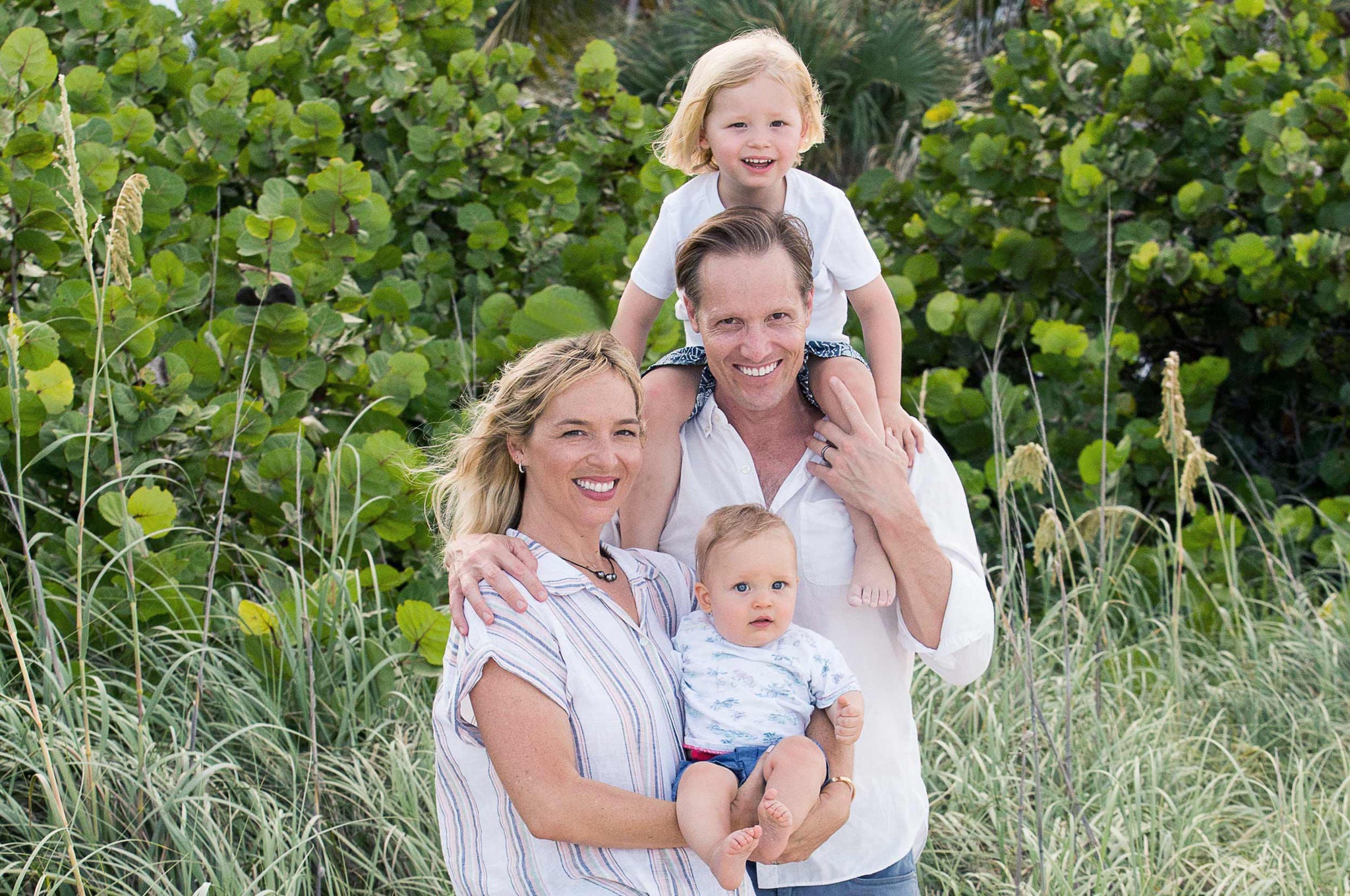 Slalom General Manager Beau Williamson and family in front of lush landscape.