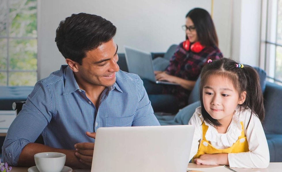 Parent and child looking at computer